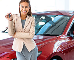 car loans thumbnail red car saleswoman medium