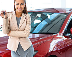 car loans thumbnail red car saleswoman
