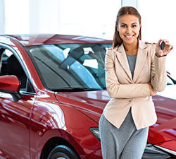 car saleswoman new red car