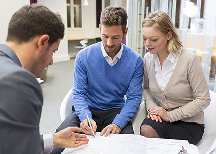 couple signing new house