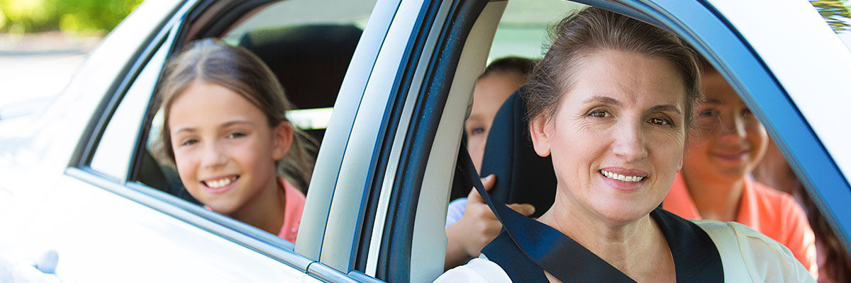 mother with lots of kids in car