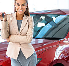 red car loan specialist holding keys