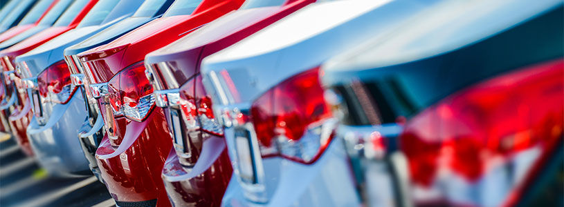 row of parked red white cars