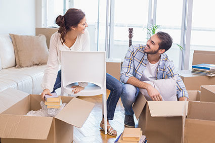 Couple moving into a new home with boxes